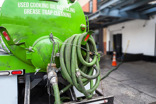 grease trap pumping truck in action in Carnation, WA